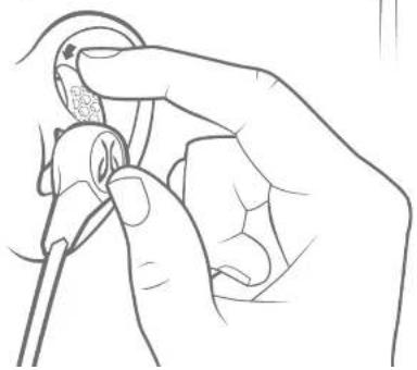 Line drawing of a hand holding a small object, possibly a tool or device, with no visible text or symbols.