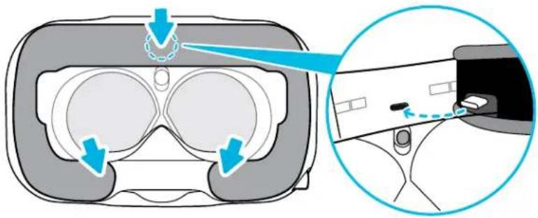 Diagram illustrating VR headset components with blue arrows indicating motion and a magnified view of the device's interior.