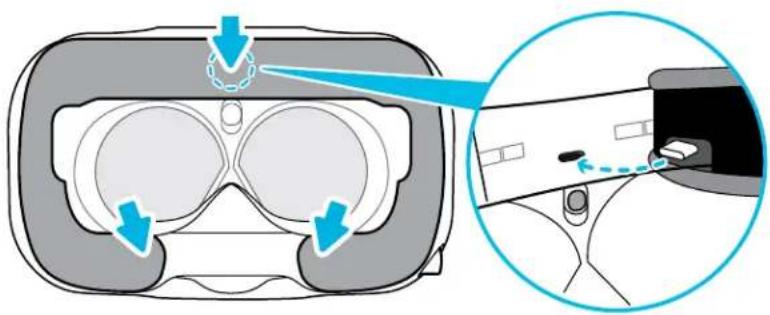Diagram illustrating VR headset components with blue arrows indicating motion and a magnified view of the device's interior.