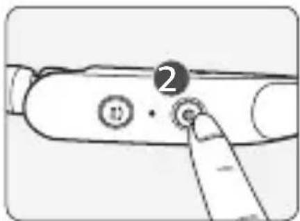 Diagram showing a finger pressing a button labeled '2' on a cylindrical device with circular buttons and a pointer.