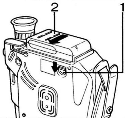 Technical diagram of a camera with labeled parts and directional arrow indicating motion or movement