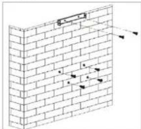 Technical diagram showing brick wall construction with labeled dimensions and arrows indicating measurement or alignment points.