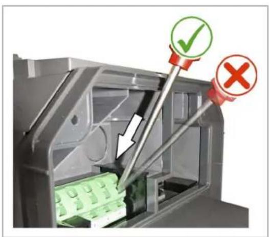 Diagram showing a mechanical device with green components and red/green checkmarks indicating approval or rejection status.