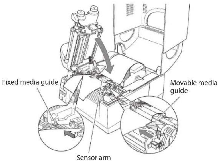 Fixed media guide Movable media guide Sensor arm