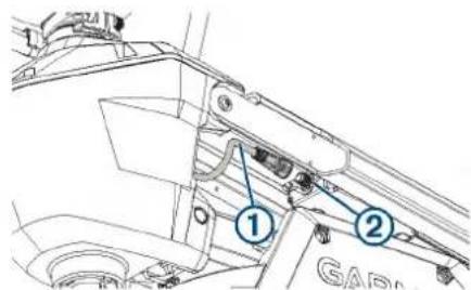 Technical diagram showing mechanical components with numbered labels 1 and 2 pointing to specific parts.