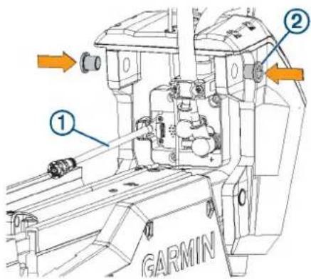 Technical diagram of a GARMIN robotic arm with labeled parts and directional arrows indicating assembly or operation.