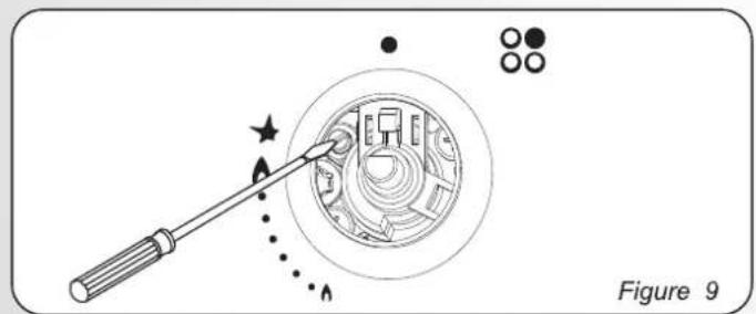 Diagram showing a tool interacting with a circular device, with no visible text or symbols
