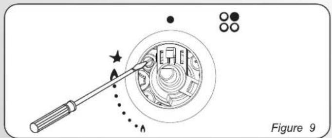 Diagram showing a tool interacting with a circular device, with no visible text or symbols