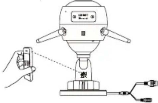 Diagram showing a robot with sensors and a hand holding a device, connected to a connector via wires.