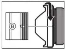 Technical diagram showing a mechanical assembly with labeled component B and directional arrow indicating motion or force