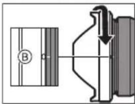 Technical diagram showing a mechanical assembly with labeled component B and directional arrow indicating motion or force