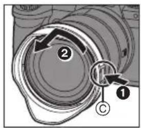 Diagram of a camera lens assembly with numbered components and directional arrows indicating motion or movement.