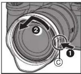 Diagram showing a camera lens assembly with labeled parts and directional arrows indicating motion or movement.