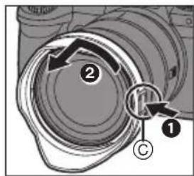 Diagram showing a camera lens with labeled parts and directional arrows, including numbered annotations ① and ②.