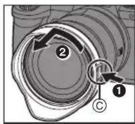 Diagram showing a camera lens assembly with labeled parts and directional arrows indicating motion or movement.