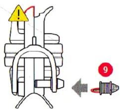 Diagram showing a mechanical component with warning symbols and a numbered indicator (9) pointing to a red bolt.