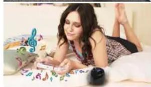 Woman lying on a bed using a smartphone with musical notes and a microphone nearby (no visible text or symbols)