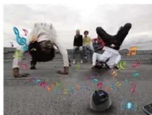 Two people performing a physical exercise with colorful motion markers on the ground (no text or symbols visible)
