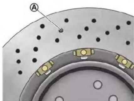 Close-up of a mechanical component with perforated surfaces and mounting brackets (no visible text or symbols)