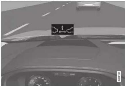 Car dashboard view with visible speedometer and lane markings, showing road ahead and dashboard display