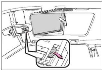 Diagram showing car interior and dashboard compartment with a highlighted device component