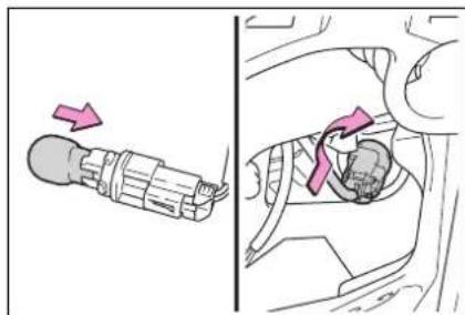 Diagram showing a car seatbelt switch with directional arrow and rotation indicator