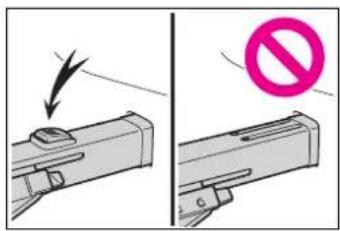 Diagram showing a device with a downward arrow and a prohibition symbol, likely illustrating a safety or hazard scenario.