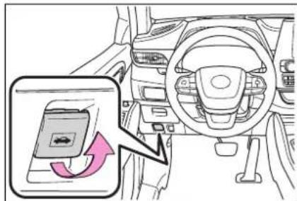 Diagram showing car interior with a highlighted seatbelt switch and directional arrow, likely illustrating vehicle safety or steering system adjustment.