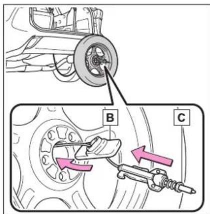 Technical diagram showing mechanical assembly with labeled parts B and C, including a wheel component and spring mechanism.