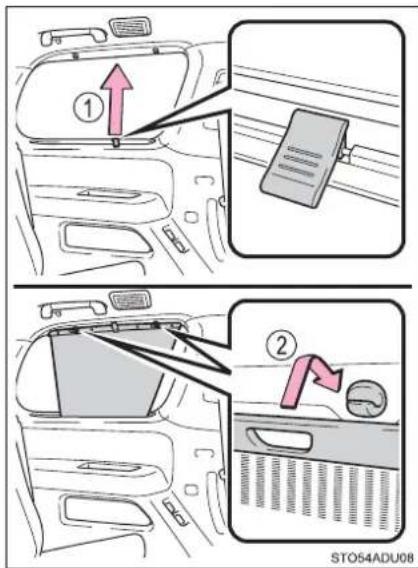 Diagram showing car interior and side view of a seatbelt switch, with numbered instructions for lifting or adjusting the seatbelt.