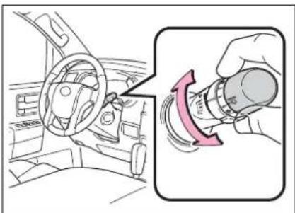 Diagram showing car interior and hand valve adjustment with red arrow indicating rotation direction