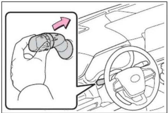Diagram showing hand turning a car's steering wheel, with an arrow indicating the direction of change.