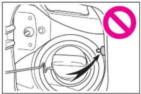 Diagram showing a device with a black arrow pointing to a circular component and a pink prohibition symbol nearby.