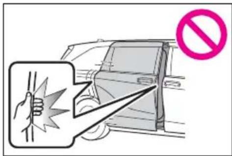 Diagram showing a hand holding a warning sign and pointing to a car, with a no-smoking symbol nearby.