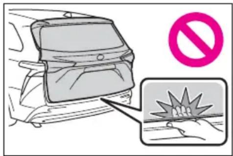 Diagram showing a car seatbelt with a no-smoking symbol and a magnified view of the impact on a broken surface.