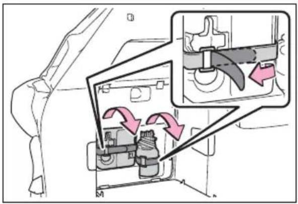 Diagram showing mechanical assembly with labeled components and directional arrows indicating movement or force