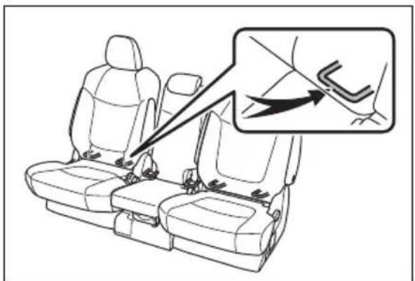 Diagram showing car seatbelt buckle assembly with magnified detail highlighting the seatbelt mechanism