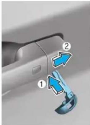 Diagram showing a car door handle with blue arrows indicating movement or change, labeled with numbers 1 and 2.