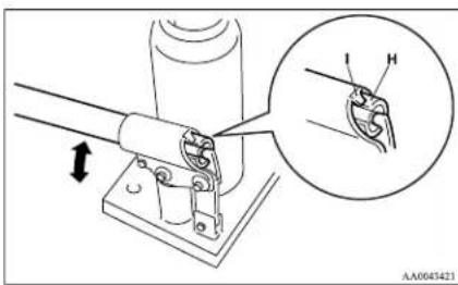 Technical diagram showing mechanical assembly with labeled parts and a magnified inset highlighting a detail of a joint detail.