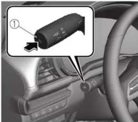 Car interior diagram with labeled component and directional arrow, showing a battery component in the dashboard.