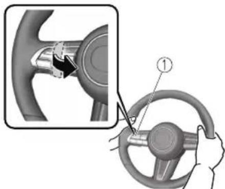 Diagram showing car steering wheel and hand positioning with labeled component ①