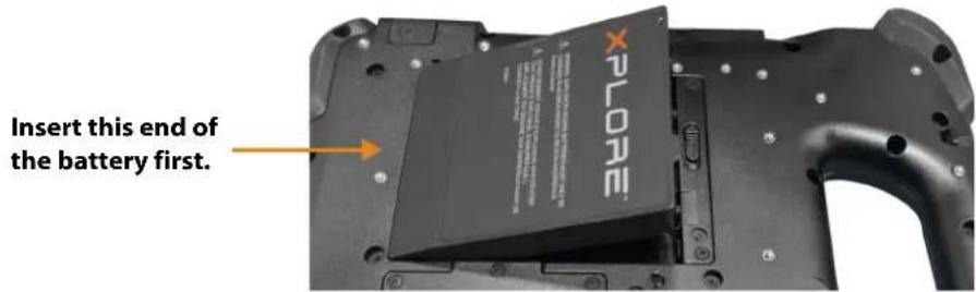 Insert this end of the battery first.