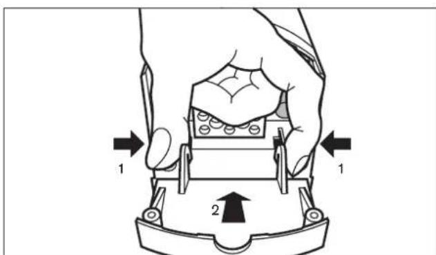 Diagram showing a hand holding a mechanical component with labeled parts and directional arrows indicating movement or force.