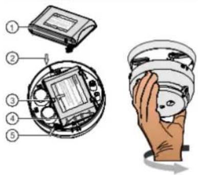 Diagram showing exploded view of a device with numbered parts and a hand holding a sensor or sensor module.