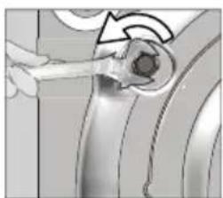 Close-up of a hand holding a small object with a circular feature, possibly a tool or device (no visible text or symbols)
