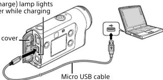 Charge) lamp lights or while charging cover Micro USB cable