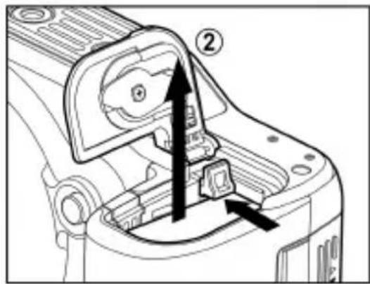 Technical diagram of a camera component with labeled parts and directional arrows indicating assembly or movement.