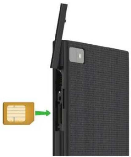 Close-up of a black electronic device with a green arrow pointing to its side panel (no text or symbols visible)