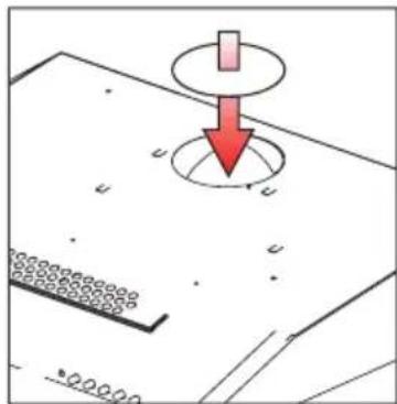 Diagram showing a red downward arrow pointing to a circular target on a textured surface, with no readable text or symbols.
