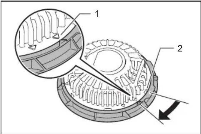 Technical diagram of a mechanical gear assembly with labeled parts 1 and 2, showing internal gear structure and directional arrow.